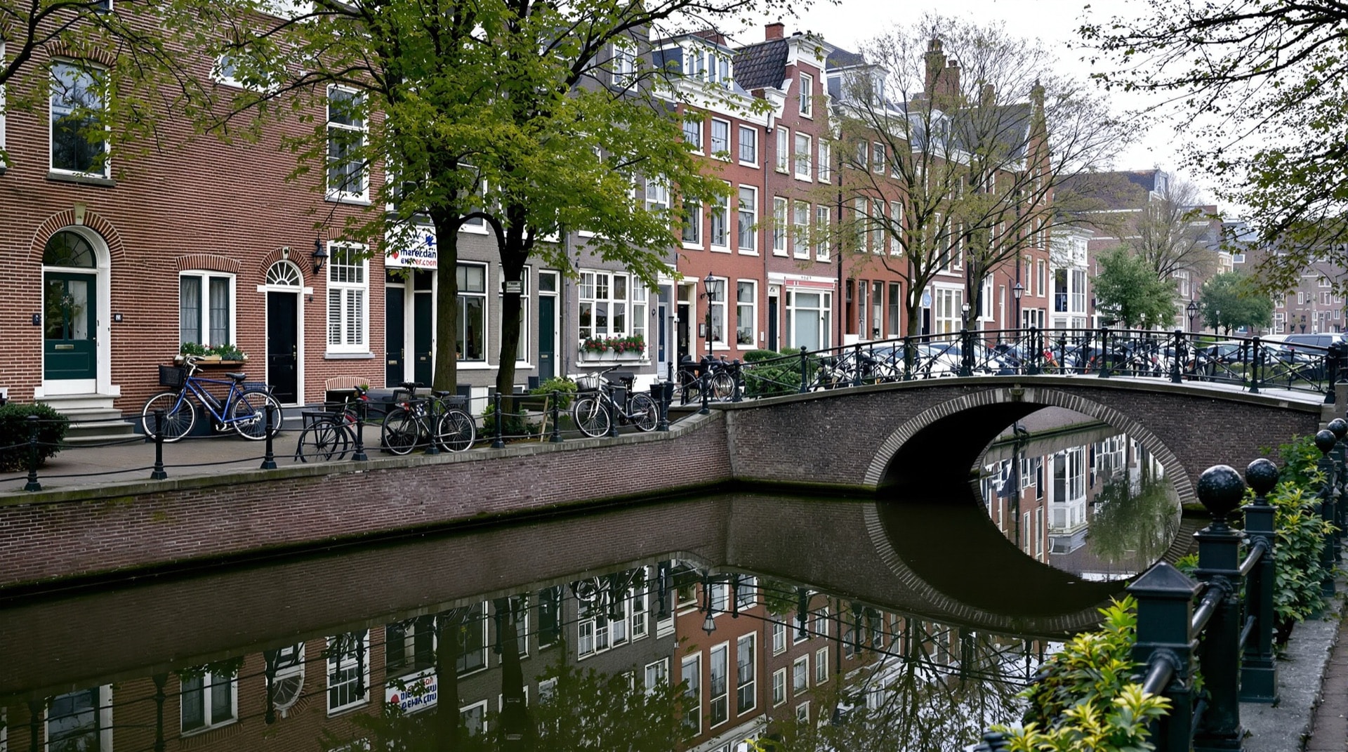 A canal lined with brick townhouses in Utrecht, the Netherlands